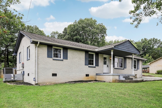 back of property featuring a yard