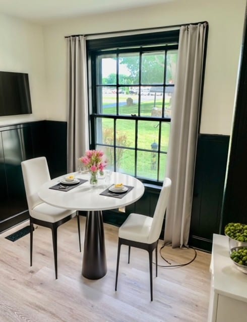 dining area featuring a healthy amount of sunlight and light hardwood / wood-style floors