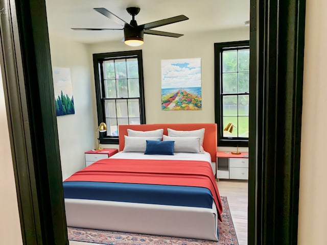 bedroom featuring ceiling fan and hardwood / wood-style floors