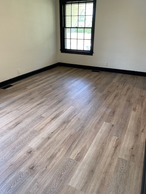 empty room featuring light hardwood / wood-style flooring