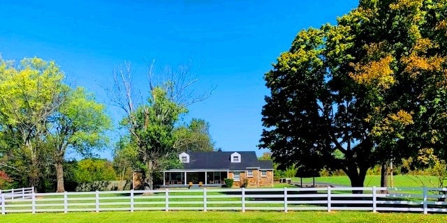 view of yard with a rural view