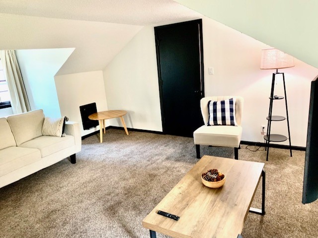 living room with carpet flooring and lofted ceiling