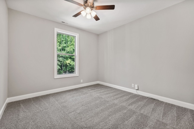 empty room featuring ceiling fan and carpet floors