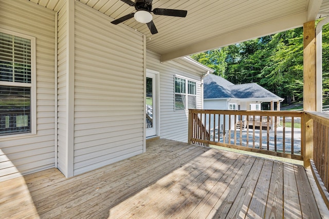 wooden terrace featuring ceiling fan