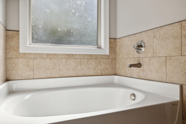 bathroom featuring a tub