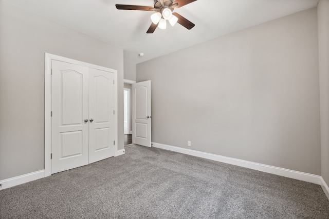 unfurnished bedroom featuring ceiling fan, carpet floors, and a closet