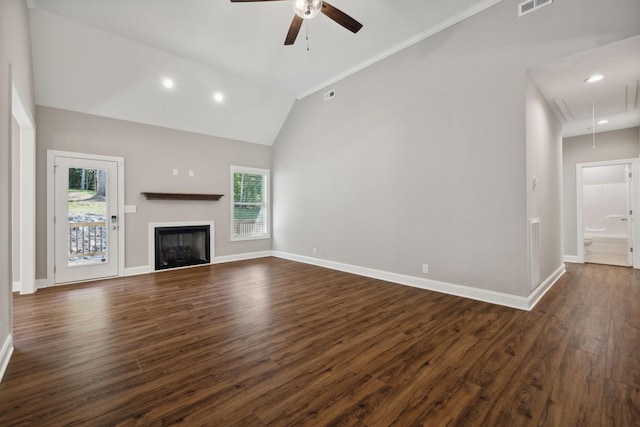 unfurnished living room with ceiling fan, plenty of natural light, dark hardwood / wood-style floors, and high vaulted ceiling