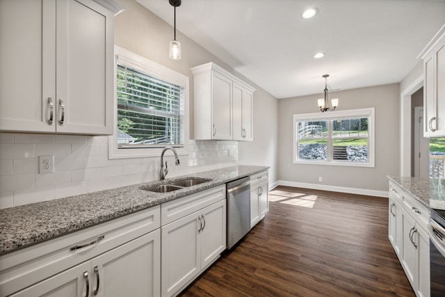 kitchen featuring tasteful backsplash, dark hardwood / wood-style floors, stainless steel appliances, and sink