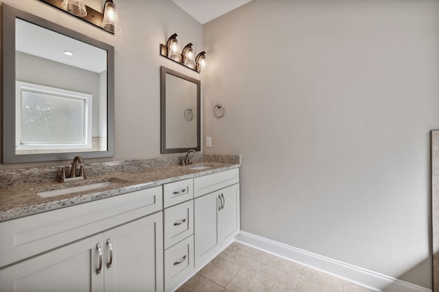 bathroom featuring dual vanity and tile patterned flooring