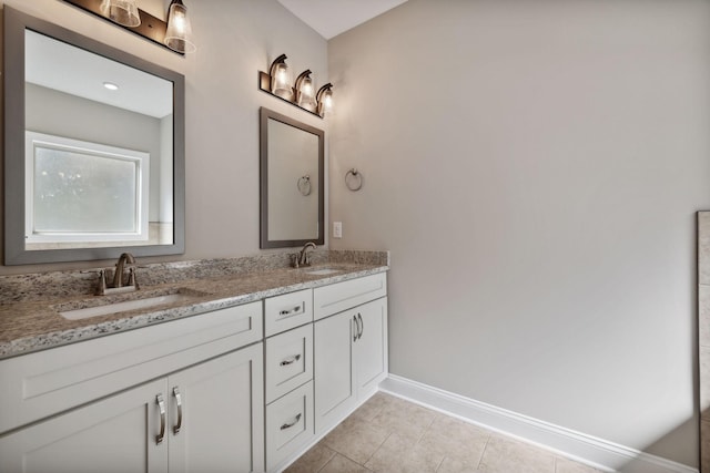 bathroom with vanity and tile patterned flooring