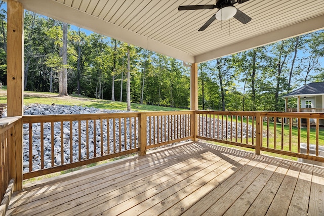 wooden deck featuring ceiling fan