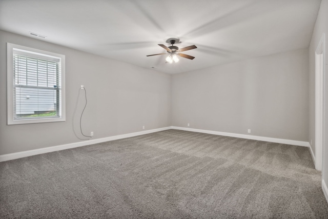 empty room featuring ceiling fan and carpet floors