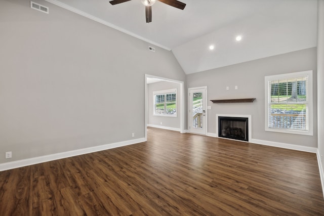 unfurnished living room featuring ceiling fan, dark hardwood / wood-style flooring, and a wealth of natural light