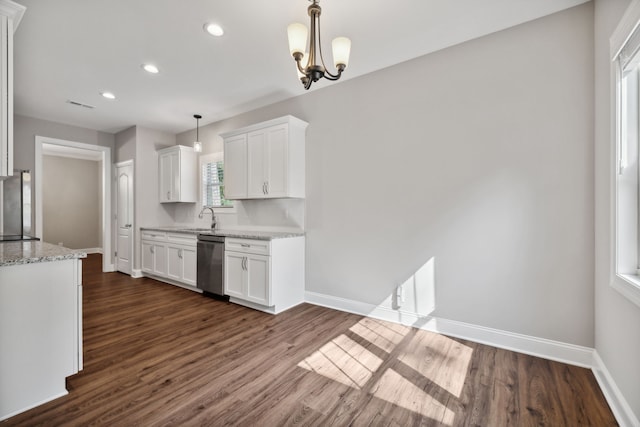 kitchen featuring light stone counters, white cabinetry, appliances with stainless steel finishes, pendant lighting, and dark hardwood / wood-style flooring