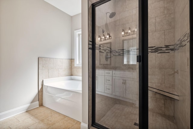 bathroom featuring tile patterned flooring, vanity, and separate shower and tub