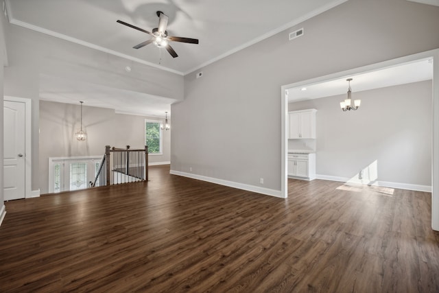 unfurnished living room with dark hardwood / wood-style flooring, ornamental molding, ceiling fan with notable chandelier, and a high ceiling