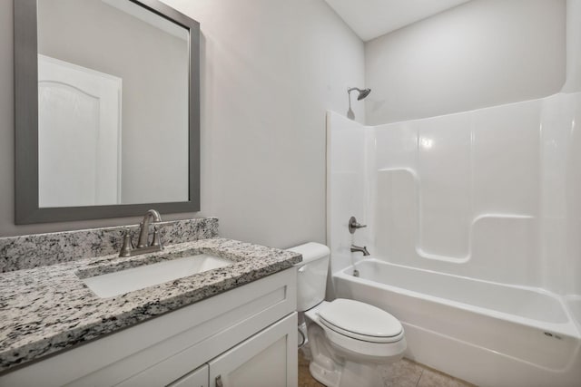 full bathroom featuring washtub / shower combination, vanity, toilet, and tile patterned flooring