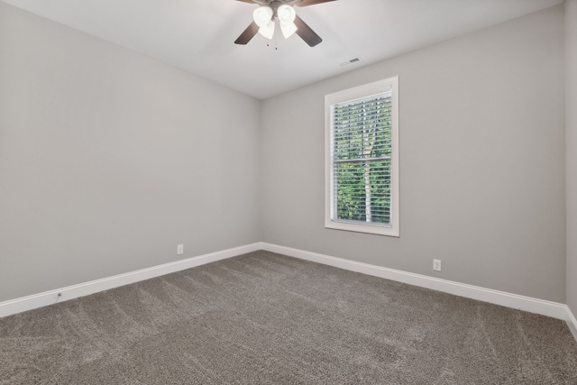 carpeted empty room featuring ceiling fan