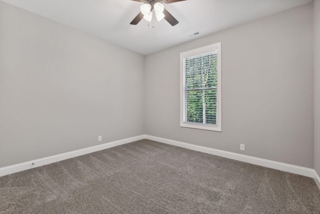 spare room featuring carpet floors and ceiling fan