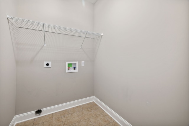 laundry area featuring tile patterned floors, hookup for a washing machine, and hookup for an electric dryer