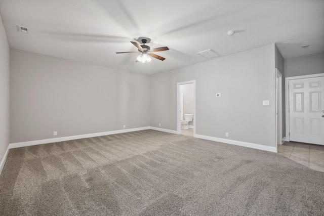 carpeted empty room with ceiling fan