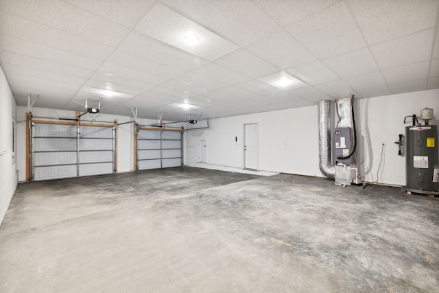 garage with electric water heater and a garage door opener