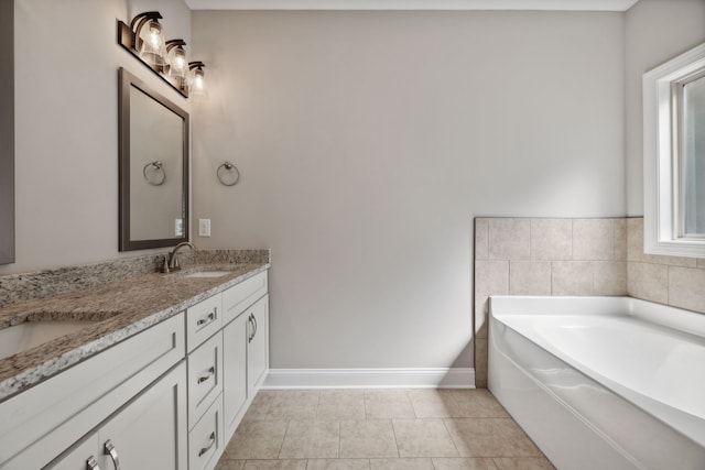 bathroom featuring dual vanity, tile patterned floors, and a bathing tub