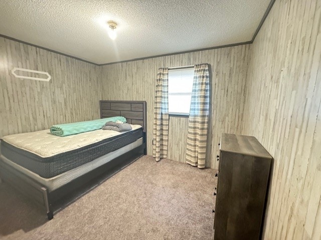 carpeted bedroom with a textured ceiling