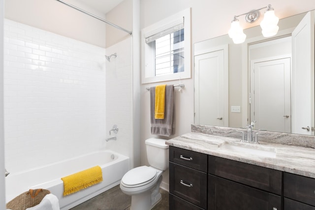 full bathroom with tiled shower / bath combo, vanity, and toilet