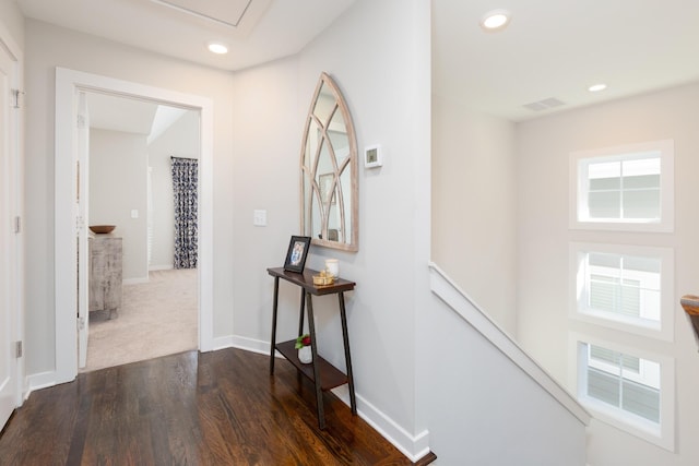 hall with dark hardwood / wood-style flooring