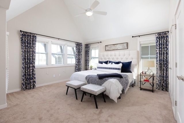 bedroom featuring ceiling fan, light colored carpet, and high vaulted ceiling