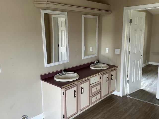 bathroom featuring hardwood / wood-style floors and vanity