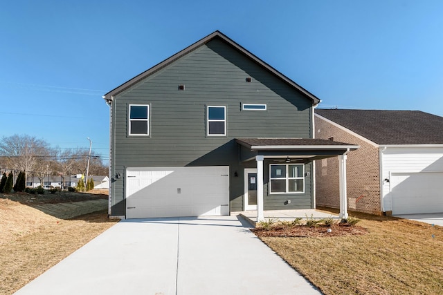 view of front of home featuring a porch, a garage, and a front yard