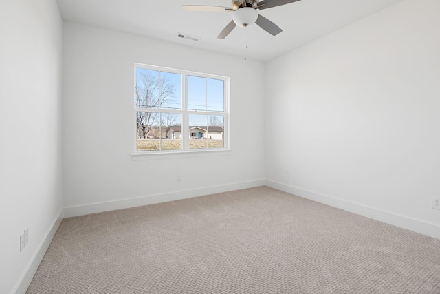 unfurnished room with carpet floors and ceiling fan