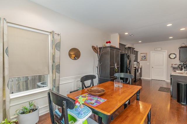 dining area featuring dark hardwood / wood-style floors