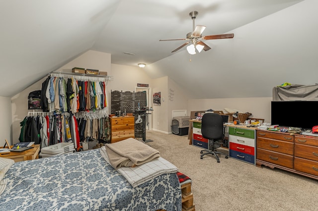 carpeted bedroom with ceiling fan and lofted ceiling