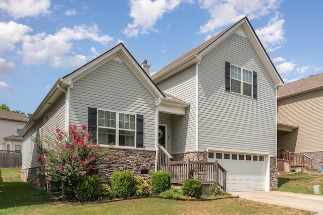 view of front of home featuring a garage and a front yard