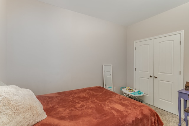 bedroom featuring light colored carpet