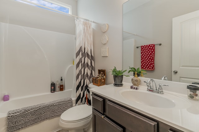 full bathroom featuring shower / bath combination with curtain, toilet, and vanity