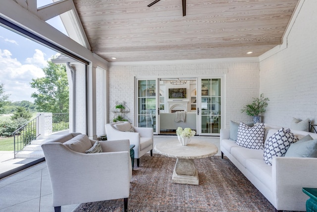 sunroom / solarium featuring wood ceiling