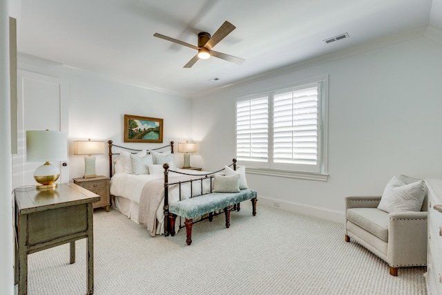 bedroom featuring crown molding, light carpet, and ceiling fan