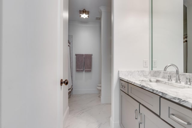 bathroom featuring vanity and toilet