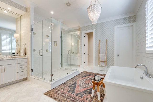 bathroom with parquet flooring, ornamental molding, separate shower and tub, vanity, and a notable chandelier