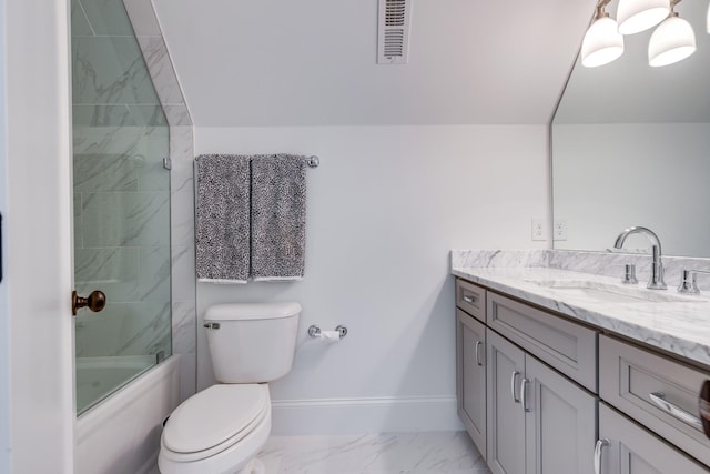 full bathroom featuring enclosed tub / shower combo, vanity, and toilet