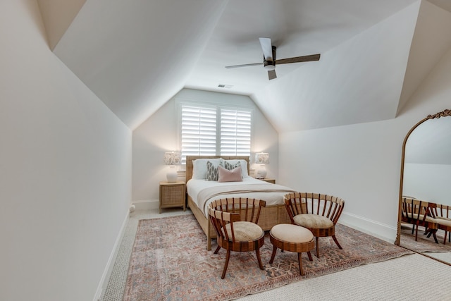 carpeted bedroom featuring vaulted ceiling and ceiling fan