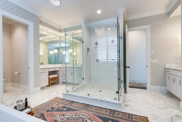 bathroom with crown molding, vanity, a shower with door, and an inviting chandelier