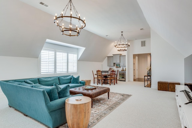 living room with wine cooler, carpet flooring, a chandelier, and vaulted ceiling