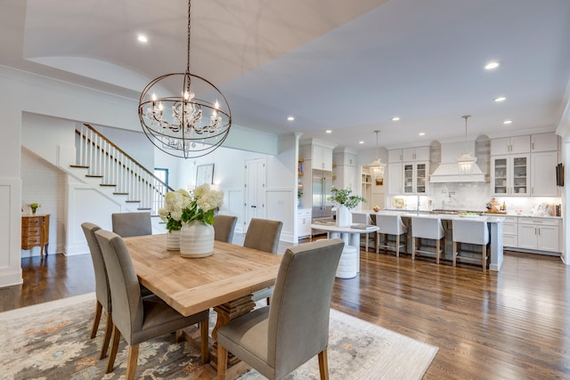 dining area featuring ornamental molding and dark hardwood / wood-style floors