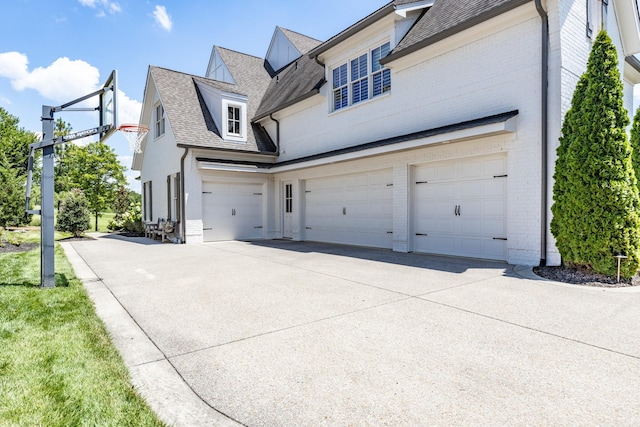 view of side of property with a garage