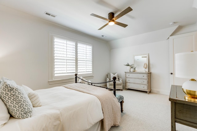 bedroom featuring lofted ceiling, light carpet, and ceiling fan